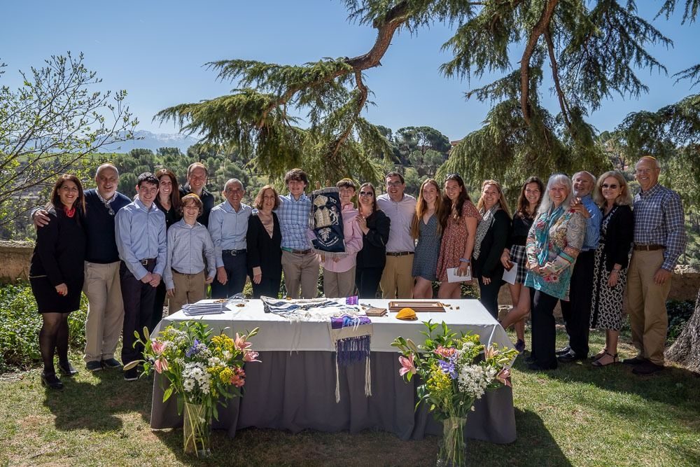 Families gathered in a garden in Segovia for a bar mitzvah